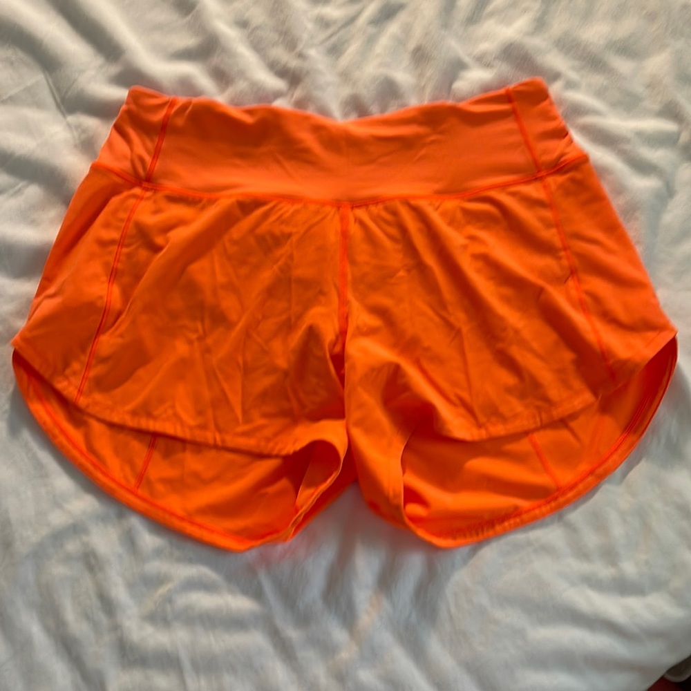 Size 4 tall highlight orange Lululemon shorts